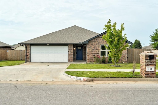11116 SW 37th St, Mustang, OK 73064 - view of front of house featuring concrete driveway, a garage, brick siding, and a shingled roof