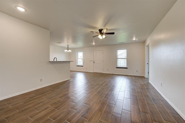 11116 SW 37th St, Mustang, OK 73064 - unfurnished living room featuring a chandelier, ceiling fan, dark wood-style floors, and recessed lighting