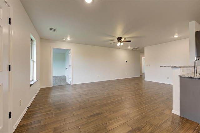 11116 SW 37th St, Mustang, OK 73064 - unfurnished living room with ceiling fan, dark wood-type flooring, and recessed lighting