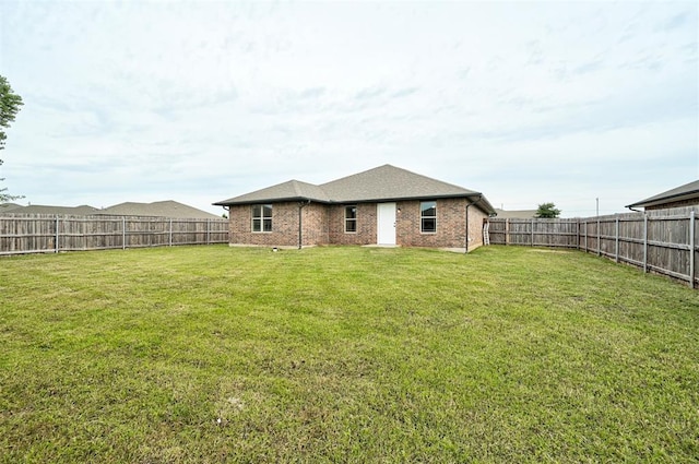 11116 SW 37th St, Mustang, OK 73064 - rear view of property featuring a fenced backyard and brick siding