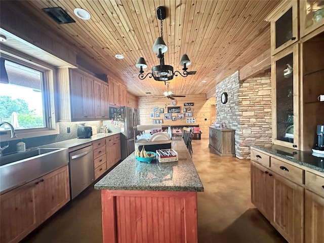 17701 S Rock Creek Rd, Shawnee, OK 74801 - kitchen with appliances with stainless steel finishes, a center island, a chandelier, wood ceiling, and concrete flooring