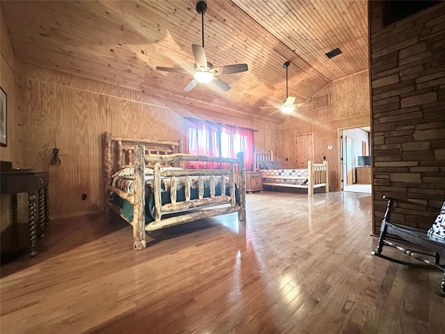 17701 S Rock Creek Rd, Shawnee, OK 74801 - bedroom with hardwood / wood-style flooring, wood walls, high vaulted ceiling, wood ceiling, and a ceiling fan