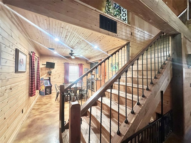 17701 S Rock Creek Rd, Shawnee, OK 74801 - stairs featuring finished concrete flooring, wood walls, and ceiling fan