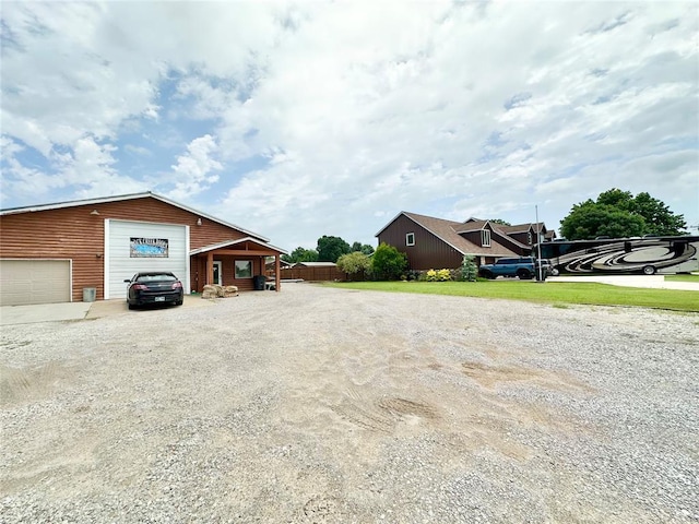 17701 S Rock Creek Rd, Shawnee, OK 74801 - view of side of home featuring dirt driveway and a detached garage