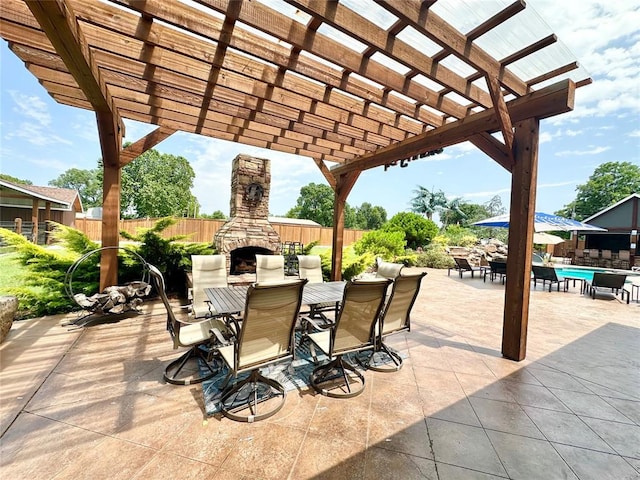 17701 S Rock Creek Rd, Shawnee, OK 74801 - view of patio featuring an outdoor stone fireplace, outdoor dining space, and a pergola