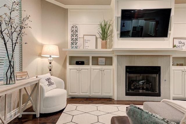 2473 Vellano Ln, Edmond, OK 73034 - living room with dark wood-type flooring, ornamental molding, and a fireplace