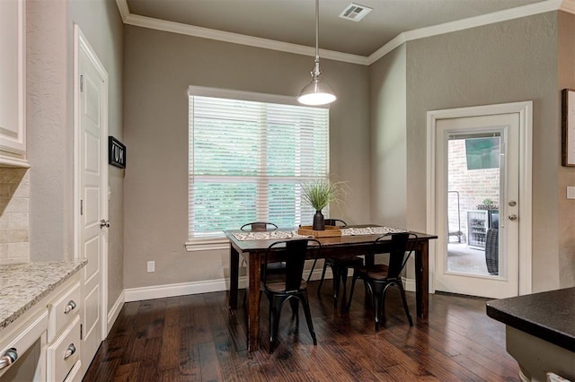 2473 Vellano Ln, Edmond, OK 73034 - dining area featuring dark wood-style floors, plenty of natural light, and ornamental molding