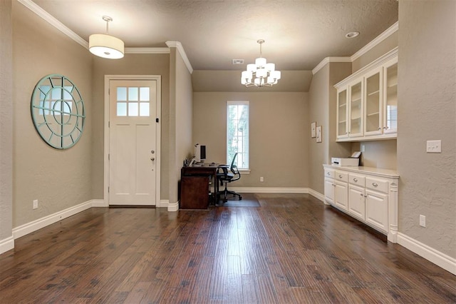2473 Vellano Ln, Edmond, OK 73034 - foyer featuring crown molding, a chandelier, and dark wood-style floors