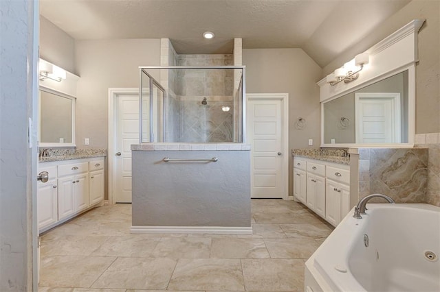 2473 Vellano Ln, Edmond, OK 73034 - bathroom with a stall shower, a tub with jets, two vanities, and lofted ceiling