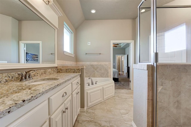 2473 Vellano Ln, Edmond, OK 73034 - ensuite bathroom with vanity, a shower stall, a bath, marble finish flooring, and recessed lighting