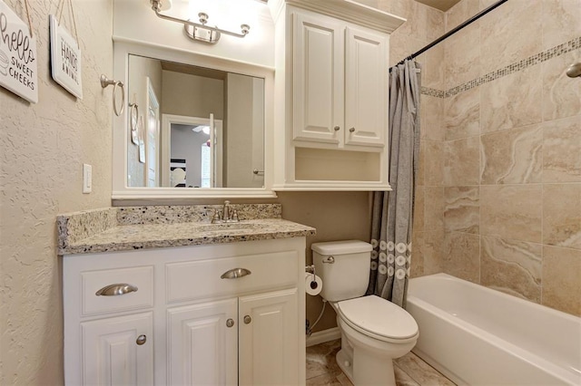 2473 Vellano Ln, Edmond, OK 73034 - full bath featuring shower / bathtub combination with curtain, vanity, and a textured wall