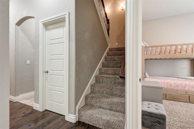2473 Vellano Ln, Edmond, OK 73034 - stairway with wood finished floors and a textured wall