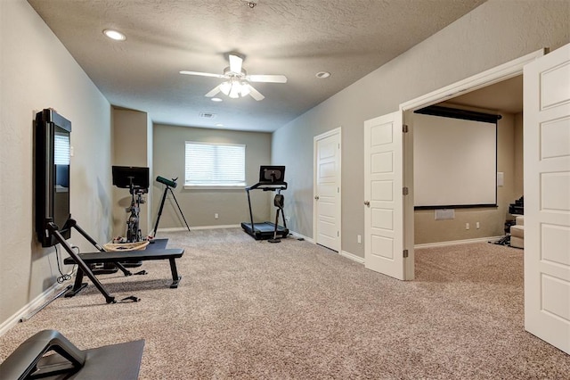 2473 Vellano Ln, Edmond, OK 73034 - exercise room featuring carpet, a ceiling fan, a textured ceiling, and recessed lighting