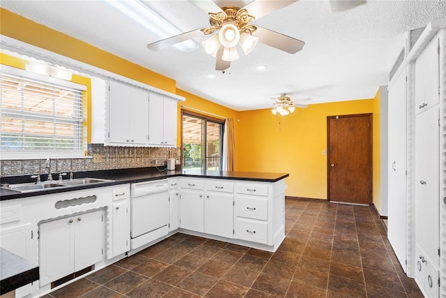 1317 Sue Ln, Choctaw, OK 73020 - kitchen featuring dishwasher, dark countertops, ceiling fan, a peninsula, and recessed lighting