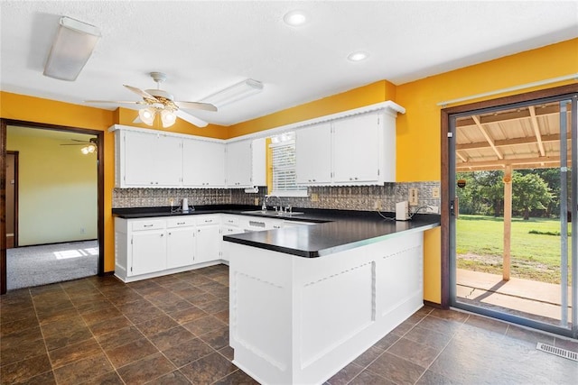1317 Sue Ln, Choctaw, OK 73020 - kitchen with plenty of natural light, dark countertops, a peninsula, ceiling fan, and recessed lighting