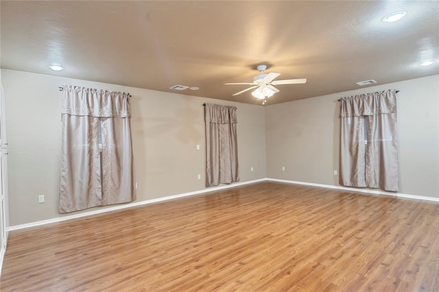 1317 Sue Ln, Choctaw, OK 73020 - empty room with light wood-type flooring, a ceiling fan, and recessed lighting