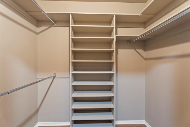 1317 Sue Ln, Choctaw, OK 73020 - walk in closet with wood finished floors