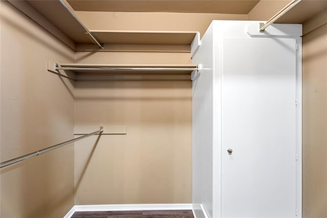 1317 Sue Ln, Choctaw, OK 73020 - walk in closet featuring wood finished floors