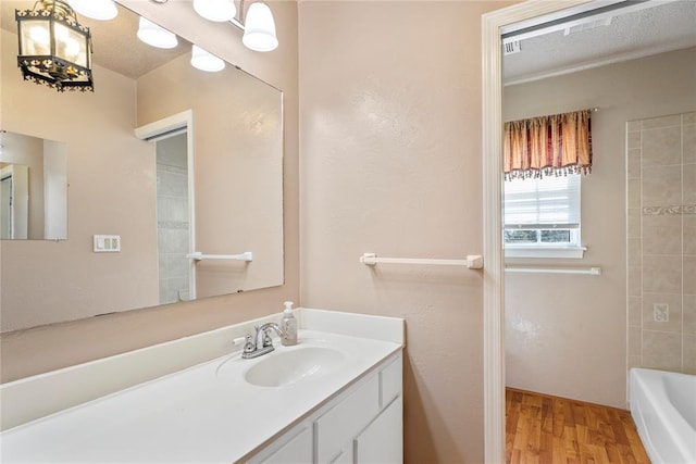 1317 Sue Ln, Choctaw, OK 73020 - full bathroom featuring wood finished floors and vanity