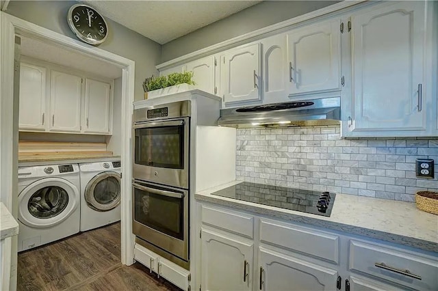 1013 Mary Lee Ln, Edmond, OK 73034 - kitchen featuring double oven, independent washer and dryer, range hood, black electric cooktop, and light countertops