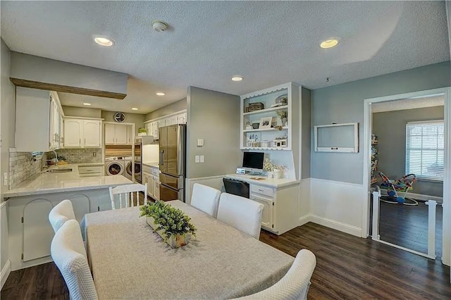 1013 Mary Lee Ln, Edmond, OK 73034 - dining room with independent washer and dryer, a textured ceiling, dark wood-style floors, and recessed lighting