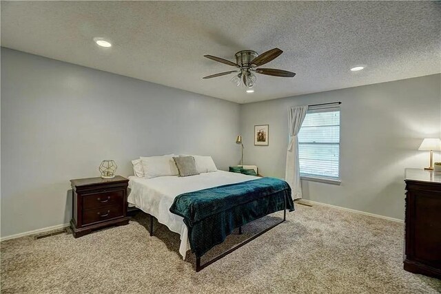 1013 Mary Lee Ln, Edmond, OK 73034 - bedroom featuring carpet flooring, a ceiling fan, a textured ceiling, and recessed lighting