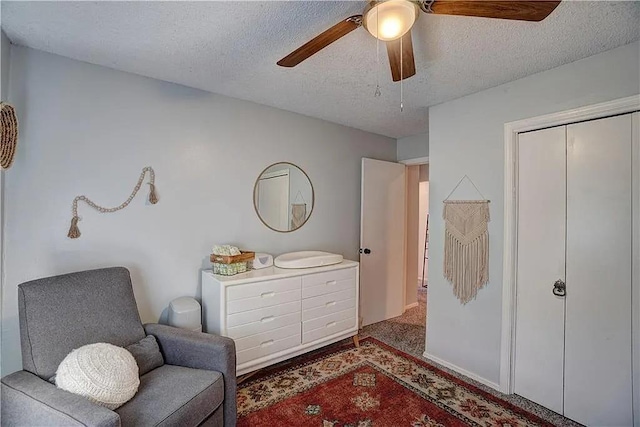 1013 Mary Lee Ln, Edmond, OK 73034 - sitting room with a textured ceiling, ceiling fan, and carpet floors