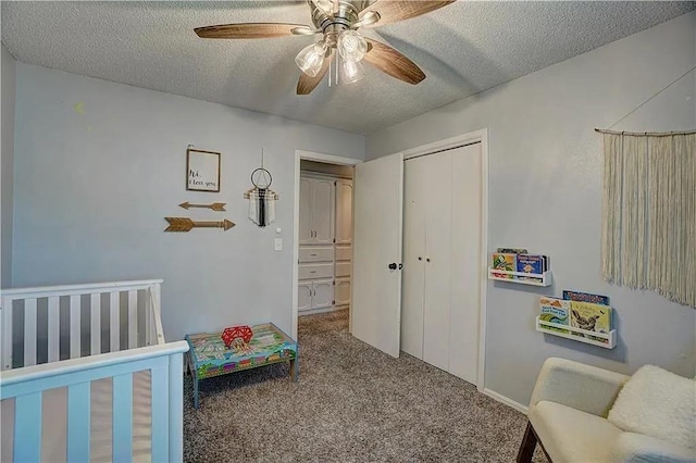 1013 Mary Lee Ln, Edmond, OK 73034 - bedroom with carpet flooring, a textured ceiling, a closet, and ceiling fan