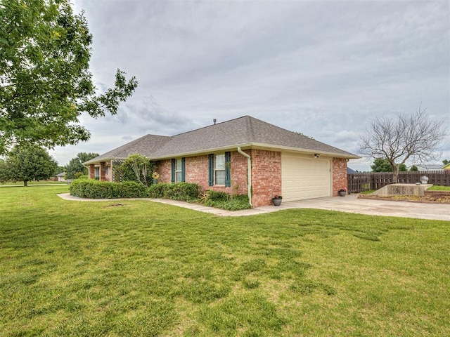 975 Garden Rd, Tuttle, OK 73089 - view of front of home featuring brick siding, concrete driveway, an attached garage, and a shingled roof