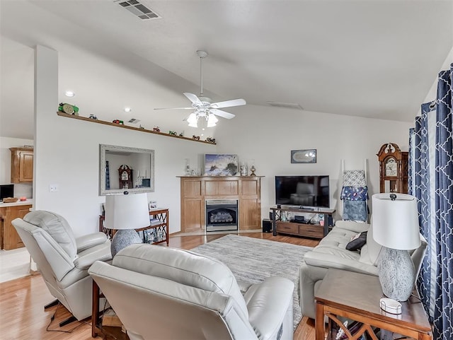 975 Garden Rd, Tuttle, OK 73089 - living room with lofted ceiling, light wood-style flooring, a ceiling fan, and a fireplace