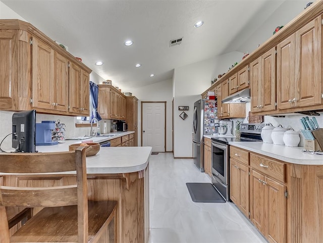 975 Garden Rd, Tuttle, OK 73089 - kitchen with stainless steel range with electric stovetop, vaulted ceiling, recessed lighting, under cabinet range hood, and light countertops