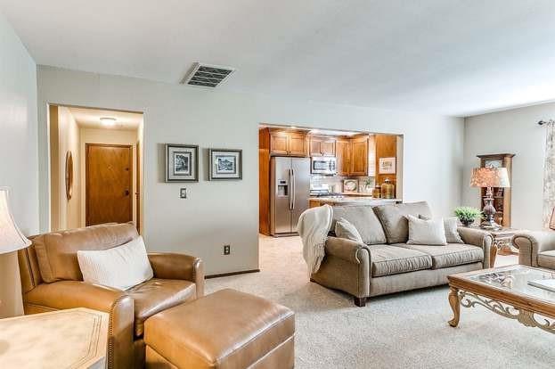 801 Belle Air Ave, Edmond, OK 73013 - living area featuring light carpet