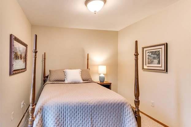 801 Belle Air Ave, Edmond, OK 73013 - carpeted bedroom with baseboards