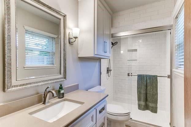 801 Belle Air Ave, Edmond, OK 73013 - bathroom featuring vanity and a stall shower