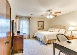 801 Belle Air Ave, Edmond, OK 73013 - bedroom with light colored carpet and a ceiling fan