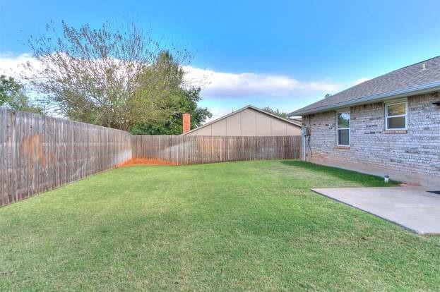 801 Belle Air Ave, Edmond, OK 73013 - fenced backyard with a patio