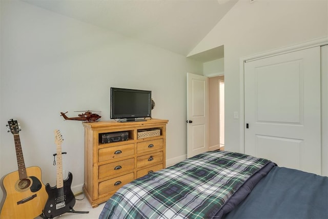 1300 Oak Springs Ln, Edmond, OK 73034 - bedroom with vaulted ceiling and light carpet
