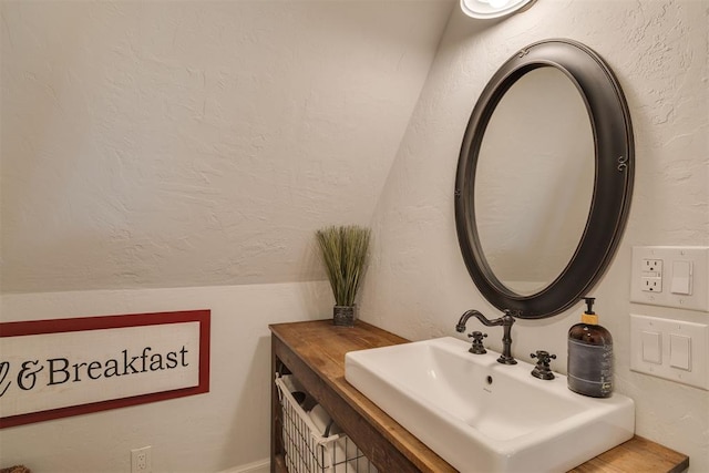 1300 Oak Springs Ln, Edmond, OK 73034 - bathroom with a textured wall and vanity