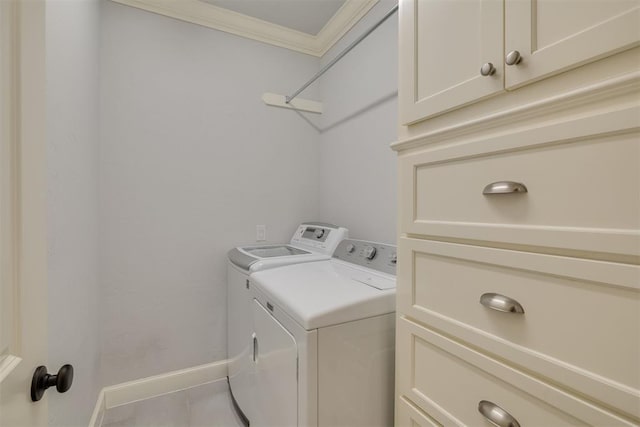 1300 Oak Springs Ln, Edmond, OK 73034 - washroom with separate washer and dryer, ornamental molding, and cabinet space