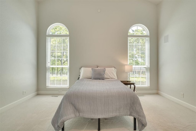 1300 Oak Springs Ln, Edmond, OK 73034 - bedroom with carpet flooring and multiple windows