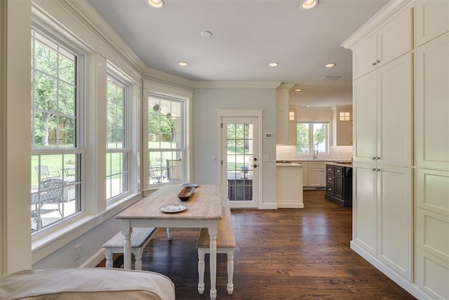 1300 Oak Springs Ln, Edmond, OK 73034 - dining room with dark wood-style floors, crown molding, and recessed lighting