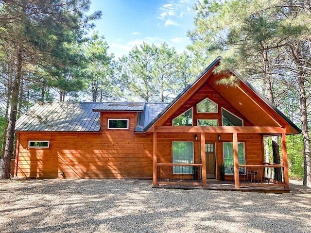 142 Champion Way, Broken Bow, OK 74728 - rustic home with covered porch and a metal roof