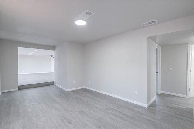 spare room featuring wood finished floors
