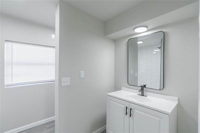 bathroom with vanity and wood finished floors