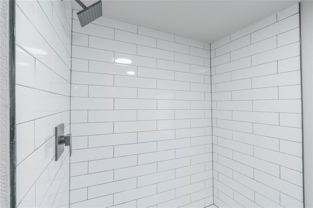 bathroom with a tile shower