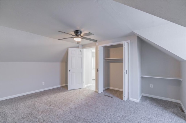bonus room with carpet flooring, ceiling fan, and vaulted ceiling