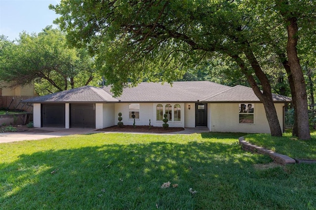 1112 Mary Lee Ln, Edmond, OK 73034 - ranch-style home featuring concrete driveway, an attached garage, a front lawn, and brick siding