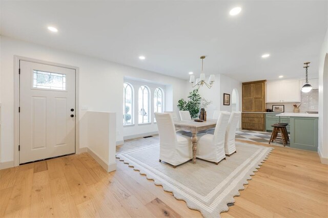 1112 Mary Lee Ln, Edmond, OK 73034 - dining area with light wood finished floors, plenty of natural light, a chandelier, and recessed lighting