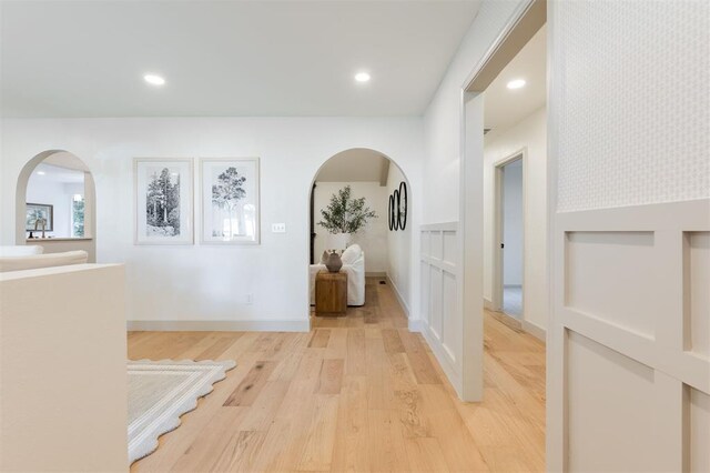 1112 Mary Lee Ln, Edmond, OK 73034 - corridor with arched walkways, light wood finished floors, and recessed lighting