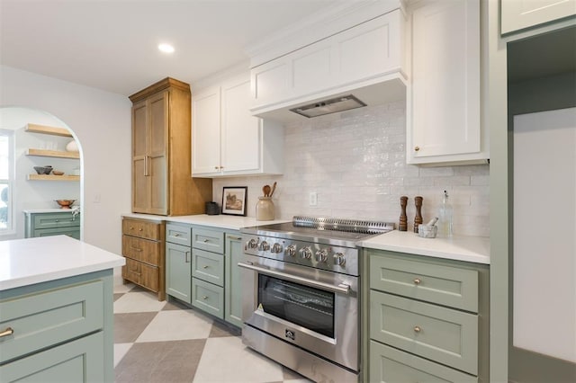 1112 Mary Lee Ln, Edmond, OK 73034 - kitchen featuring stainless steel range, green cabinetry, light countertops, backsplash, and recessed lighting